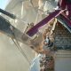 excavator demolishing a house